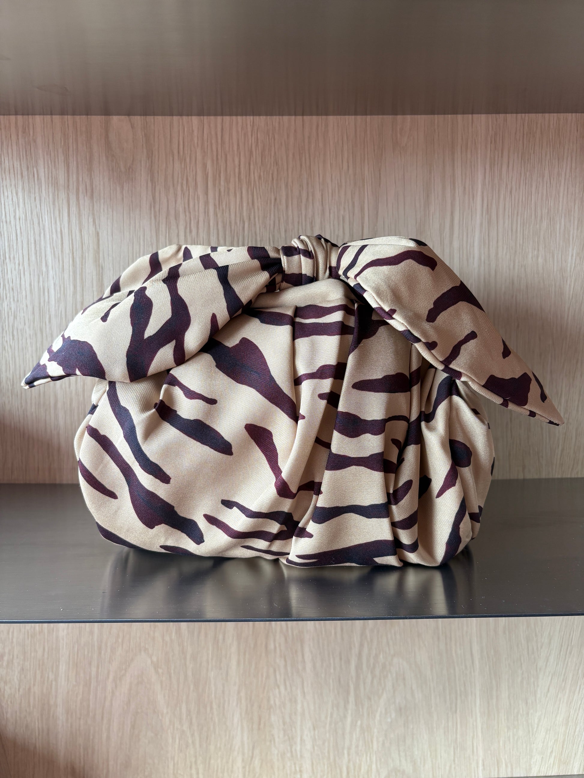 Folded fabric with a pattern on a wooden surface