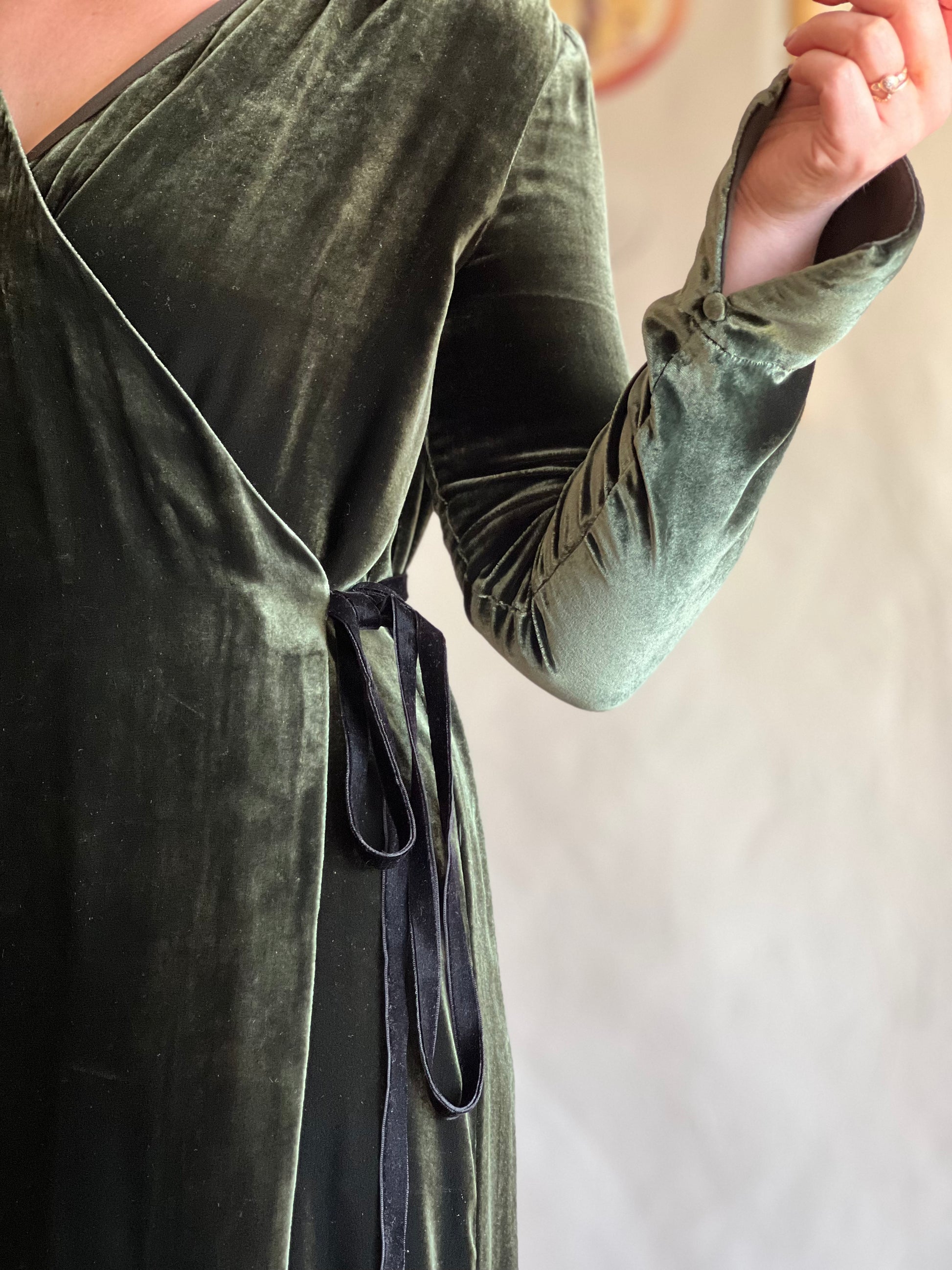 Toast Emerald Green Velvet Wrap Dress close-up worn on model 
