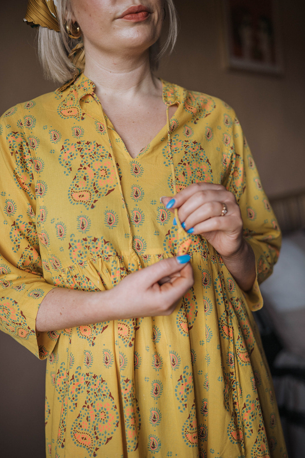  Toast Yellow Printed Midi Dress worn on model close up
