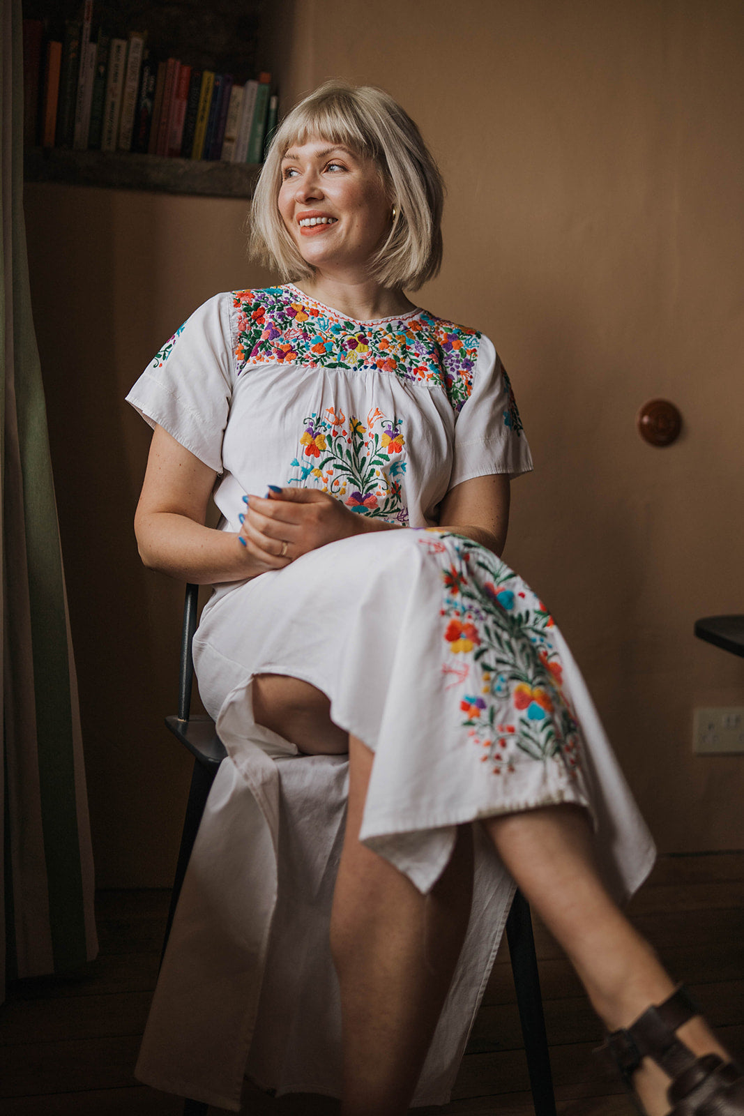 Vintage Folk Embroidered Floral Maxi Dress worn on seated model 